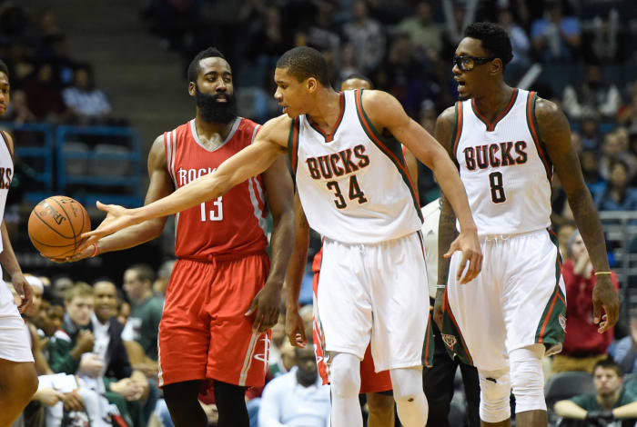 Milwaukee Bucks guard Giannis Antetokounmpo (34) knocks the ball away form Houston Rockets guard James Harden (13)